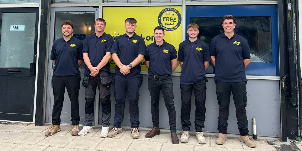 APP Electrical team stood together infront of new Cardiff office.