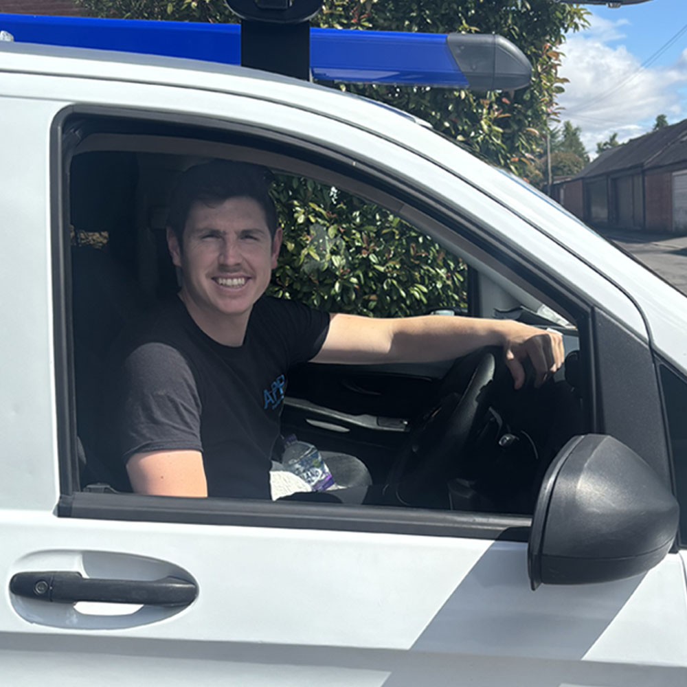 APP Electrical team member Andrew inside of van.