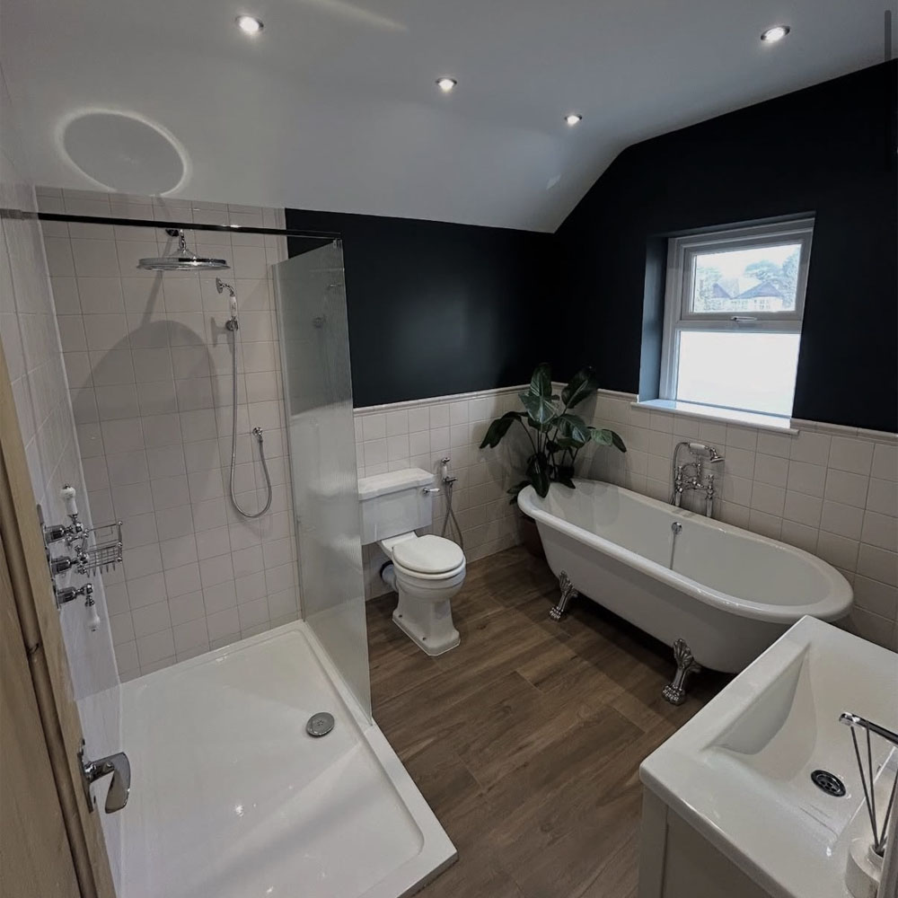 Homeonwer bathroom after underfloor heating installation by APP Electrical.