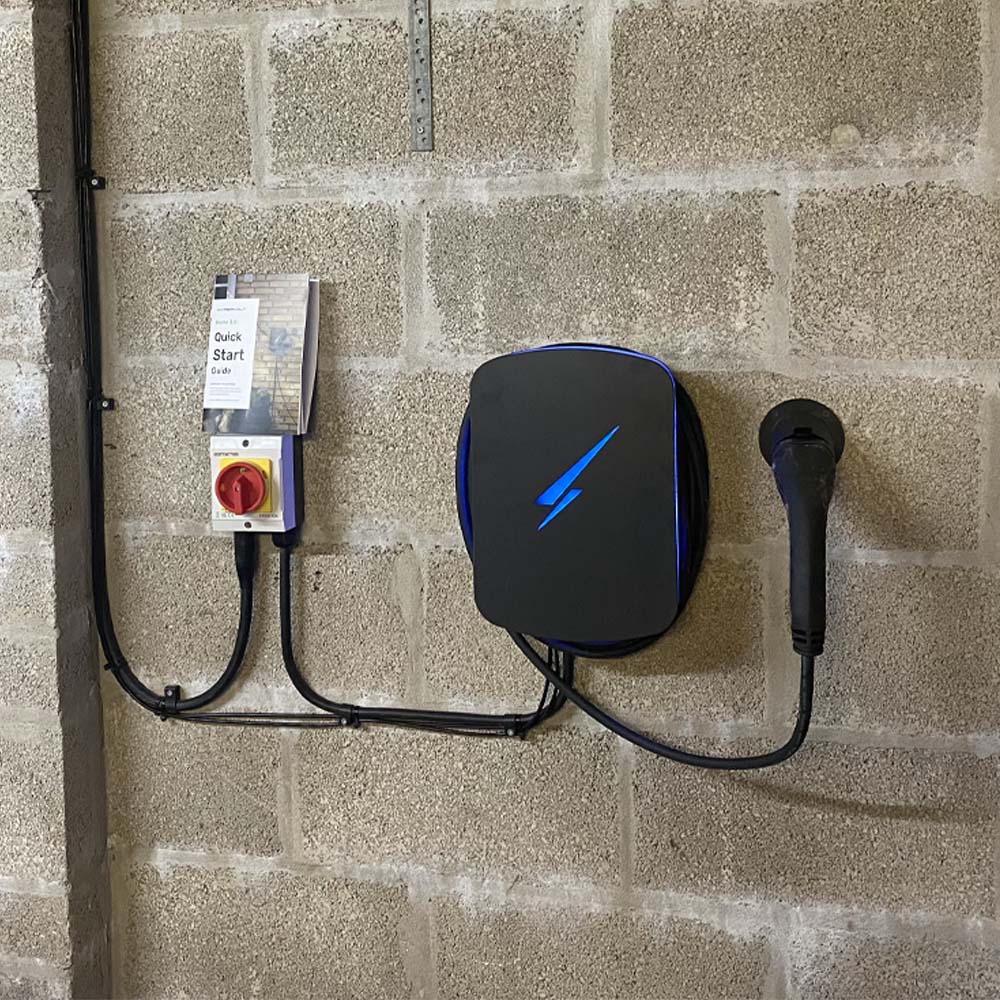 EV charing point installed inside south wales garage by APP Electrical.