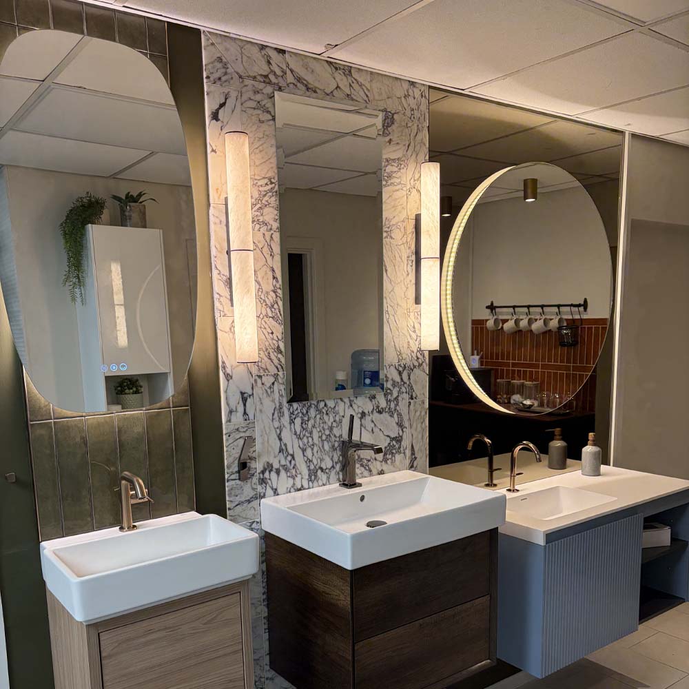 Bathroom electrics installed by APP Electrical featuring mirror lights.