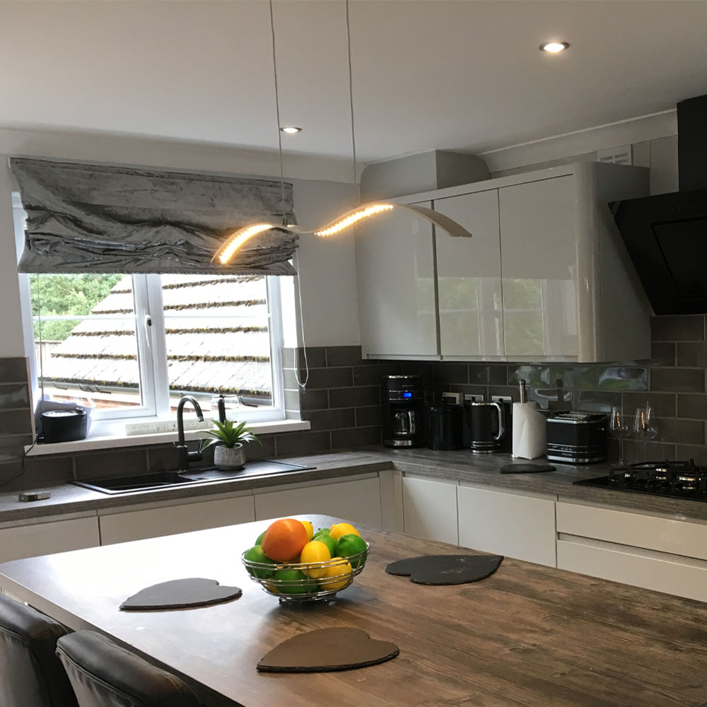 Completed kitchen installation featuring hanging and ceiling lighting installed by APP Electrical.